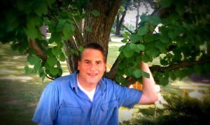Stuart Carroll under a tree.